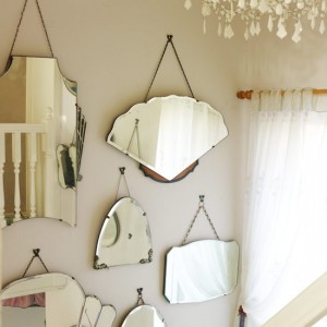 Group mirrors of different shapes and sizes  for a touch of Art Deco glamour!