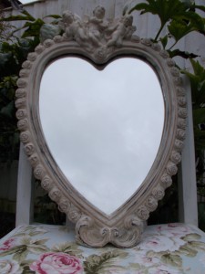 Look for mirrors with pretty details such as flowers, scrolls and cherubs...